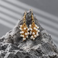 Staged Pearls Gold loop Earrings