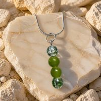 Peridot 8mm and Green crackled glass 8mm silver Pendant